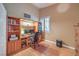 Home office with built-in shelving, natural light, and space for a computer setup at 1145 Glacier Park Ct, Henderson, NV 89052