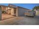 Covered patio area with neutral decor and outdoor seating provides a relaxing space with vehicle parking at 1145 Glacier Park Ct, Henderson, NV 89052