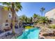 Aerial view of an incredible backyard with a pool, waterfall, beautiful landscaping, and outdoor living spaces at 1246 Diamond Valley St, Henderson, NV 89052