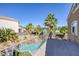 Upper balcony showcasing a view of the pool, lush landscaping, and neighborhood at 1246 Diamond Valley St, Henderson, NV 89052
