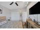 Bedroom with vaulted ceilings, ceiling fan, TV, and updated furniture at 1246 Diamond Valley St, Henderson, NV 89052