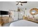 Stylish bedroom showcasing rustic dresser and ensuite bath/walk-in closet with barn door at 1246 Diamond Valley St, Henderson, NV 89052