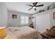 Cozy bedroom featuring neutral decor, ceiling fan, plantation shutters and spacious closet at 1246 Diamond Valley St, Henderson, NV 89052