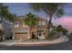 Beautiful two-story home with desert landscaping and a two-car garage on a well-manicured lot at 1246 Diamond Valley St, Henderson, NV 89052