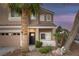 Inviting home exterior showcasing manicured landscaping, a cozy porch, and a two-car garage at 1246 Diamond Valley St, Henderson, NV 89052
