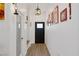 Bright hallway featuring wood-look floors, fresh white paint, and modern lighting fixtures at 1246 Diamond Valley St, Henderson, NV 89052