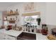 Modern kitchen featuring a farmhouse sink and view to backyard pool at 1246 Diamond Valley St, Henderson, NV 89052