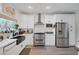 Clean, modern kitchen with stainless appliances and farmhouse sink at 1246 Diamond Valley St, Henderson, NV 89052