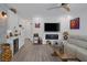 Open-concept living room with modern fixtures, bar, and fireplace at 1246 Diamond Valley St, Henderson, NV 89052