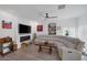 Cozy living room with fireplace, large TV, and modern ceiling fan at 1246 Diamond Valley St, Henderson, NV 89052