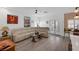 Bright living room with a sectional sofa, wood-look flooring, and lots of natural light at 1246 Diamond Valley St, Henderson, NV 89052