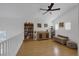 Cozy loft with ceiling fan, hardwood floors, and built-in bookshelves at 1246 Diamond Valley St, Henderson, NV 89052