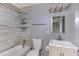 Renovated bathroom with stylish tile surround, modern fixtures, and a vanity sink at 1372 Lorilyn Ave # 3, Las Vegas, NV 89119