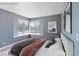 Inviting bedroom with two corner windows, neutral color palette, and comfortable bed at 1372 Lorilyn Ave # 3, Las Vegas, NV 89119