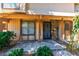 Up close view of the entryway featuring a security screen door and stone accents at 1372 Lorilyn Ave # 3, Las Vegas, NV 89119