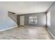 Inviting living room featuring staircase access to the upper level and neutral paint palette at 1372 Lorilyn Ave # 3, Las Vegas, NV 89119