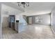 Spacious living room with kitchen island and tile flooring, offering an open and inviting layout at 1372 Lorilyn Ave # 3, Las Vegas, NV 89119