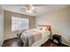 Bright bedroom features a ceiling fan, a window, and a nightstand, offering a comfortable living space at 1968 Evening Glow Dr, Las Vegas, NV 89134