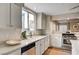Beautiful kitchen showcasing light countertops, a stainless steel dishwasher, and bright, natural lighting at 1968 Evening Glow Dr, Las Vegas, NV 89134