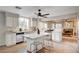 Spacious kitchen with white cabinets, a kitchen island, and modern stainless steel appliances at 1968 Evening Glow Dr, Las Vegas, NV 89134