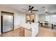 Modern kitchen featuring a large island, stainless steel refrigerator, and ample storage space at 1968 Evening Glow Dr, Las Vegas, NV 89134