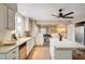 Well-lit kitchen boasts stainless steel appliances, a gas range, and a central island with seating at 1968 Evening Glow Dr, Las Vegas, NV 89134