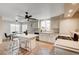 Modern kitchen with a central island, gas range, and natural light from a large window at 1968 Evening Glow Dr, Las Vegas, NV 89134