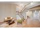 Open-concept living room featuring tile flooring and a staircase to the upper level at 1968 Evening Glow Dr, Las Vegas, NV 89134