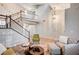 Spacious living area with a staircase, showcasing the home's design and layout at 1968 Evening Glow Dr, Las Vegas, NV 89134
