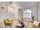 Well-lit living room with stylish furniture and an arched window, creating a welcoming atmosphere at 1968 Evening Glow Dr, Las Vegas, NV 89134