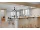 Bright and airy living space with breakfast bar and view of dining area and kitchen at 1968 Evening Glow Dr, Las Vegas, NV 89134