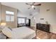 Relaxing main bedroom with wood floors, dresser and private bath at 1968 Evening Glow Dr, Las Vegas, NV 89134