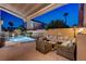 Inviting outdoor patio area with comfortable seating, ideal for enjoying evenings by the pool at 1968 Evening Glow Dr, Las Vegas, NV 89134