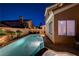 Gorgeous night view of the sparkling pool, seamlessly blending into the surrounding houses and serene backdrop at 1968 Evening Glow Dr, Las Vegas, NV 89134