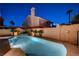 Stunning nighttime view of a private pool and landscaping, perfect for relaxation and outdoor entertaining at 1968 Evening Glow Dr, Las Vegas, NV 89134