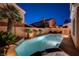 Inviting backyard pool with lush landscaping, perfect for relaxation and outdoor enjoyment at 1968 Evening Glow Dr, Las Vegas, NV 89134