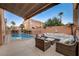 Inviting pool area with comfortable seating and a relaxing ambiance, ideal for outdoor enjoyment at 1968 Evening Glow Dr, Las Vegas, NV 89134