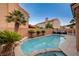 Inviting backyard oasis featuring a sparkling pool, spa, and lush tropical landscaping, perfect for relaxation at 1968 Evening Glow Dr, Las Vegas, NV 89134