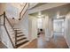 Elegant staircase with wood and white finishes, leading to the upper level of the home at 1968 Evening Glow Dr, Las Vegas, NV 89134