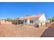 Well-maintained backyard featuring drought-tolerant landscaping and mature trees at 2109 Mountain Sunset Ave, North Las Vegas, NV 89031