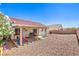 Serene backyard featuring a covered patio and drought-tolerant landscaping at 2109 Mountain Sunset Ave, North Las Vegas, NV 89031
