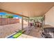 Covered patio with a built-in grill overlooking a play area at 2109 Mountain Sunset Ave, North Las Vegas, NV 89031