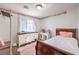 Bright bedroom featuring a classic wooden bed frame, plush carpet, and decorative wall accents at 2109 Mountain Sunset Ave, North Las Vegas, NV 89031