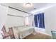 Cozy bedroom featuring canopy bed frame, soft carpet, and bright natural light at 2109 Mountain Sunset Ave, North Las Vegas, NV 89031