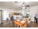 Bright dining room featuring an open concept and dark wood floors at 2109 Mountain Sunset Ave, North Las Vegas, NV 89031