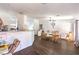 Open dining room area with a wood table, chairs, and wood-look flooring at 2109 Mountain Sunset Ave, North Las Vegas, NV 89031