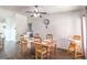 Cozy dining area with a wooden table set, seamlessly connected to living area at 2109 Mountain Sunset Ave, North Las Vegas, NV 89031