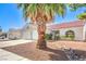 Inviting single-story home with a two-car garage, tiled roof, and drought-tolerant landscaping at 2109 Mountain Sunset Ave, North Las Vegas, NV 89031