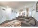 Bright living room area with a large sectional sofa and view of dining area at 2109 Mountain Sunset Ave, North Las Vegas, NV 89031