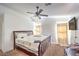 Relaxing main bedroom with a ceiling fan, comfortable bedding, and ample natural light at 2109 Mountain Sunset Ave, North Las Vegas, NV 89031